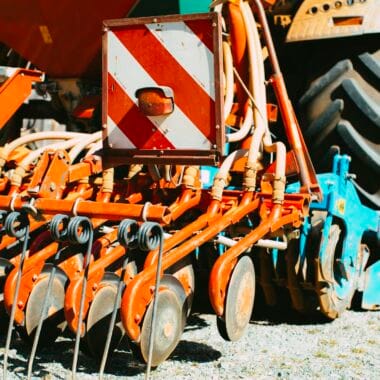 Detailed view of farming machinery showcasing tractor and cultivator parts.